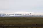 In de verte zien we de Mýrdalsjökull gletsjer in IJsland